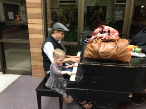 The homeschool open house was last Thursday (4/4/13) and Emily just had to help one of the older kids play the piano! He was very gracious to let her "help" him!